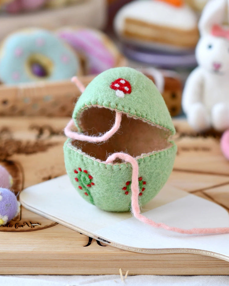 TARA TREASURES | FELT EGG COVER - GREEN WITH MUSHROOM MOTIF *PRE-ORDER* by TARA TREASURES - The Playful Collective