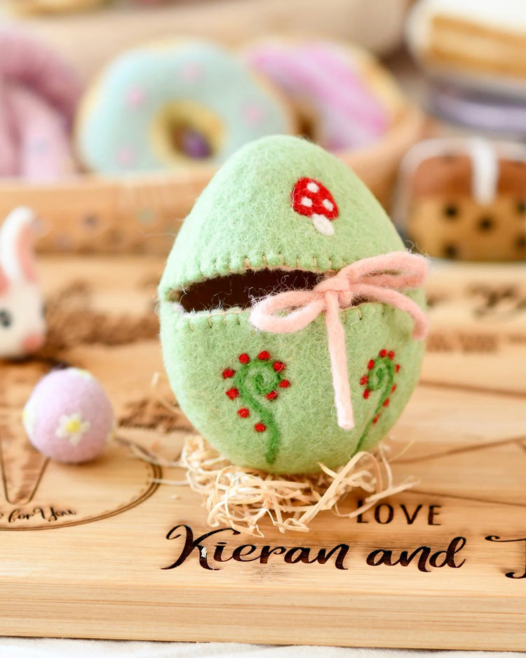 TARA TREASURES | FELT EGG COVER - GREEN WITH MUSHROOM MOTIF *PRE-ORDER* by TARA TREASURES - The Playful Collective